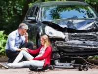 young-woman-by-the-car-after-an-accident-1.jpg
