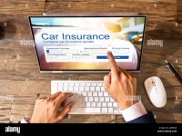 man-filling-online-car-insurance-form-on-laptop-2J856D4.jpg
